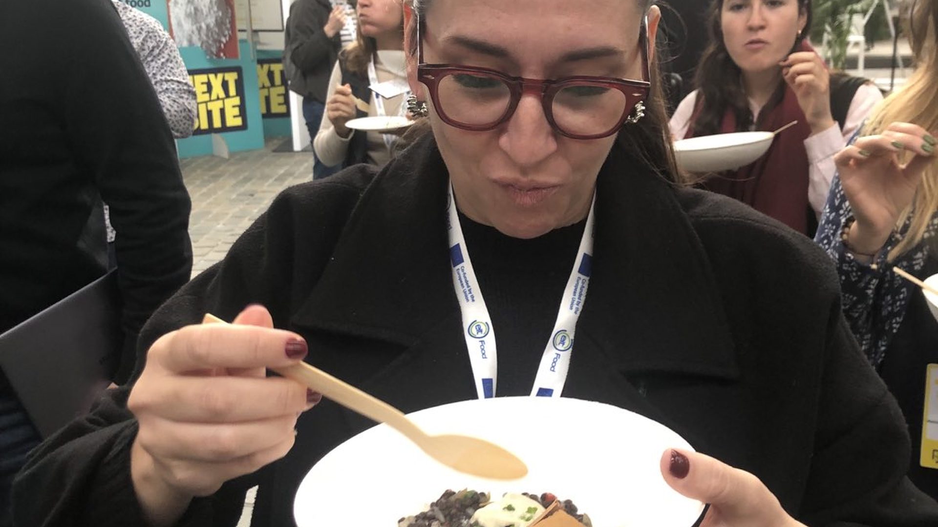 Attendee tasting an alternative protein lentil salad dish at EIT Food's Next Bite event in Brussels