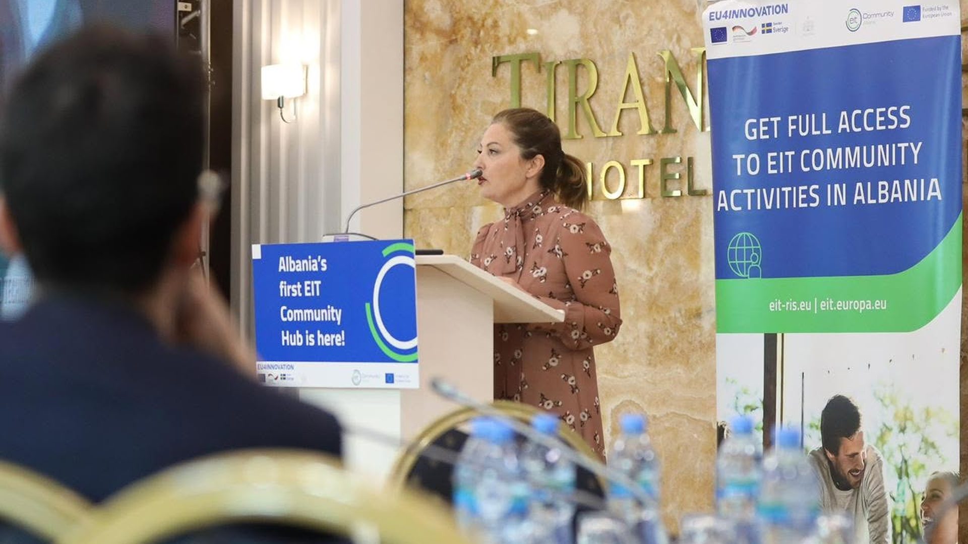 Speaker addressing the audience at Tirana International Hotel