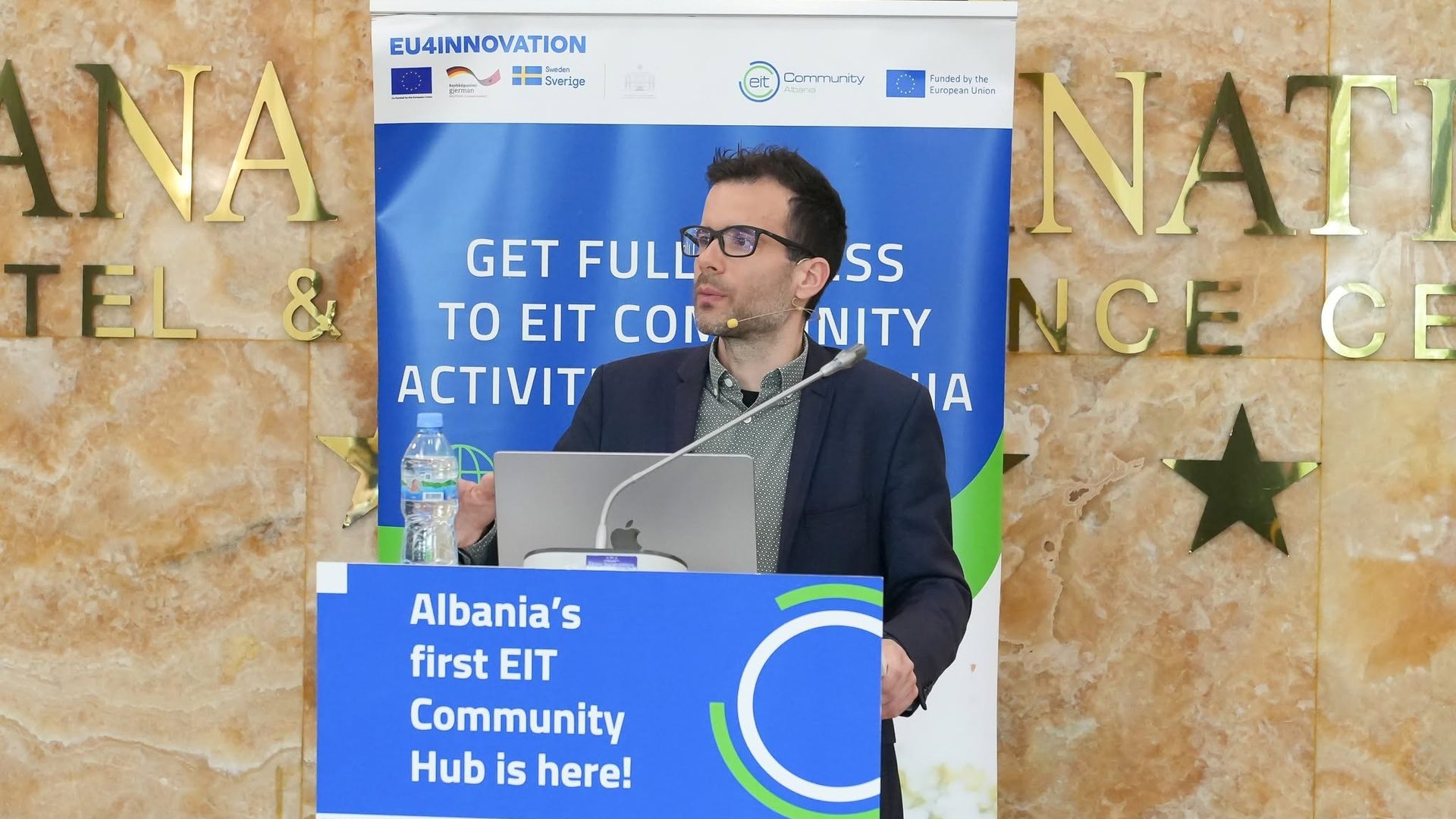 Speaker at the EIT Community Hub Albania podium in Tirana