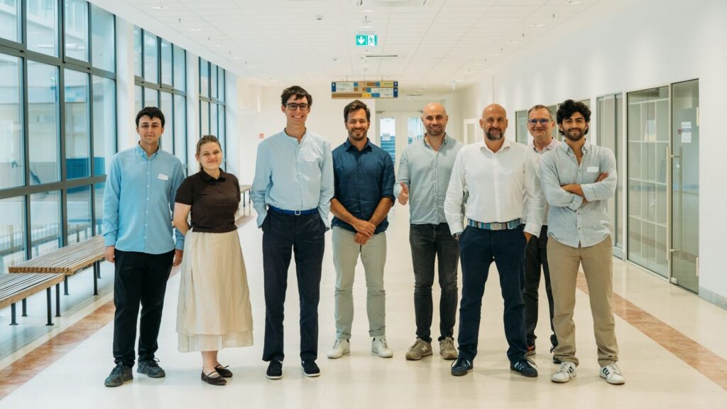 Flobe Industries team with fellow EIT Jumpstarter participants and mentors standing in a corridor