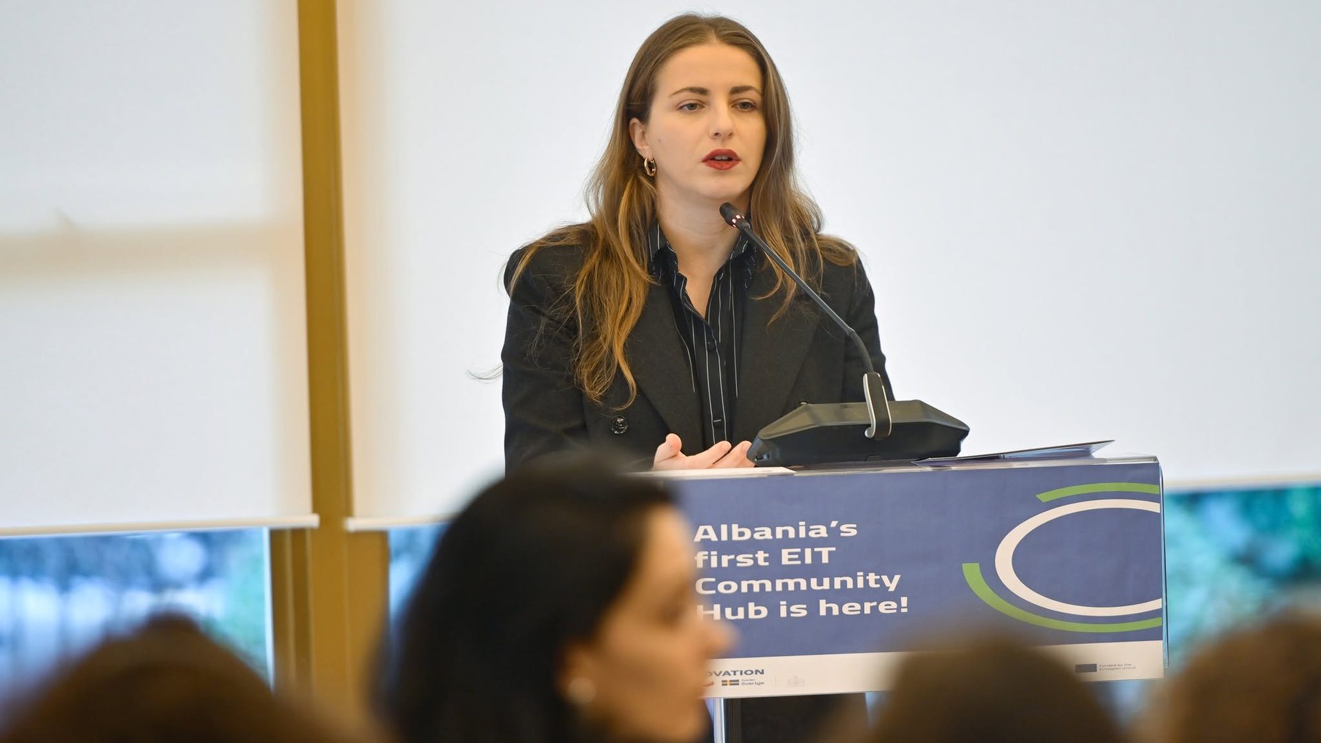 Speaker at the podium during the EIT Culture & Creativity event in Tirana